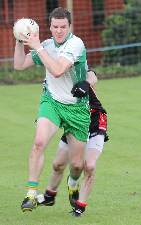 Action from the division three senior reserve football league match against Urris.