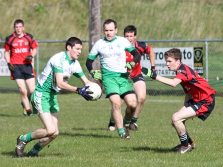 Action from the intermediate reserve football championship game against Naomh Bríd.