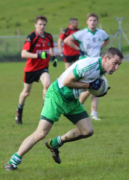 Action from the intermediate reserve football championship game against Naomh Bríd.