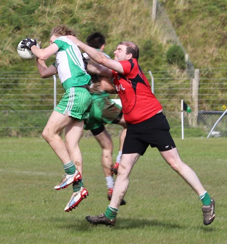 Action from the intermediate reserve football championship game against Naomh Bríd.