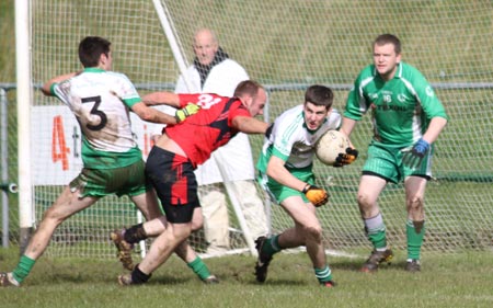 Action from the intermediate reserve football championship game against Naomh Bríd.