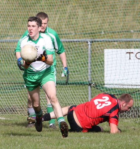 Action from the intermediate reserve football championship game against Naomh Bríd.