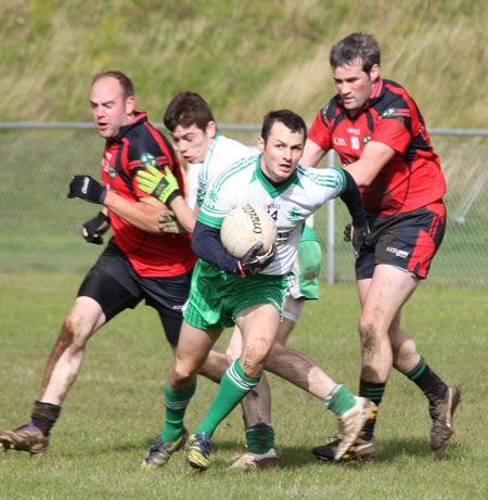 Action from the intermediate reserve football championship game against Naomh Bríd.