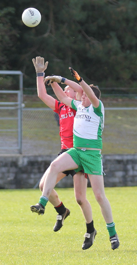 Action from the intermediate reserve football championship game against Naomh Bríd.