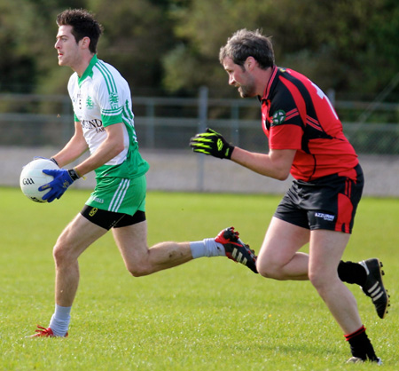 Action from the intermediate reserve football championship game against Naomh Bríd.