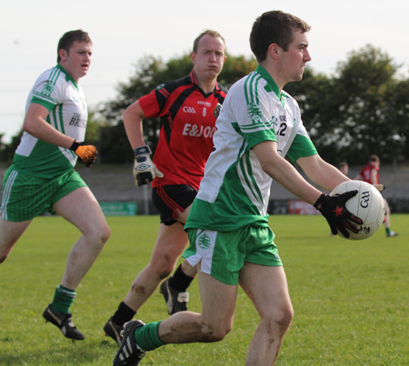 Action from the intermediate reserve football championship game against Naomh Bríd.