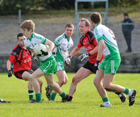 Action from the intermediate reserve football championship game against Naomh Bríd.