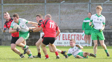 Action from the intermediate reserve football championship game against Naomh Bríd.