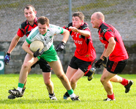 Action from the intermediate reserve football championship game against Naomh Bríd.