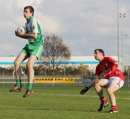 Action from the intermediate football championship semi-final against Naomh Colmcille.