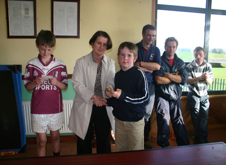 Briege Daly presenting Primary League Shield to Letterkenny Gaels captain Conor Sweeney.