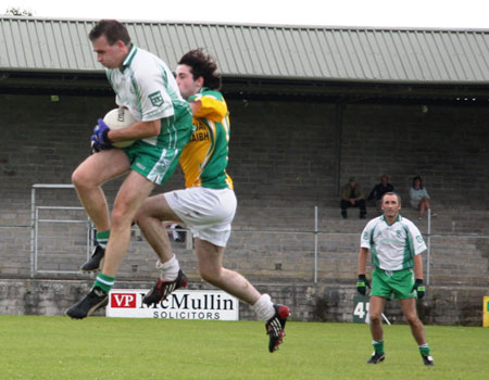 Action from Aodh Ruadh v Downings game.