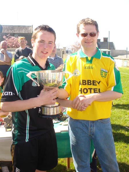 Niall Ryan presenting `the Setanta captain with the Alan Ryan Memorial Cup.