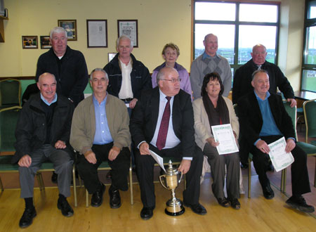 Back Row (l-r) Alan Kane, Gerry Merrifield, Margo Gallagher (wife of Eamon), Willie Sweeny and Paddy Joe Donagher. Front Row (l-r) Seamus Sweeny, Eamon Clancy, Padraig McGarrigle,(capt) Ann Britton (wife of Ernan).