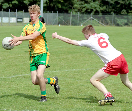 Niall Harley gets a shot away during the Buncrana cup final.