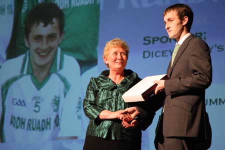 Aodh Ruadh Treasurer, Mary Grimes, presents Ronan Drummond with the third team player of the year award.