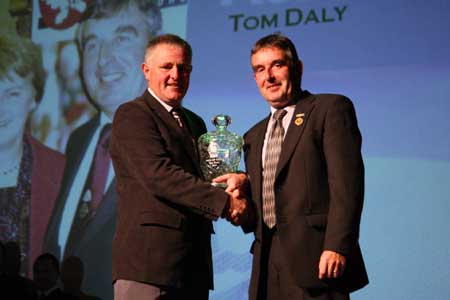 Terence McShea makes the presentation to Tom Daly.