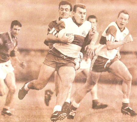 Ciaran breaks out with the ball against Naomh Columba during the 1997 Senior Championship.