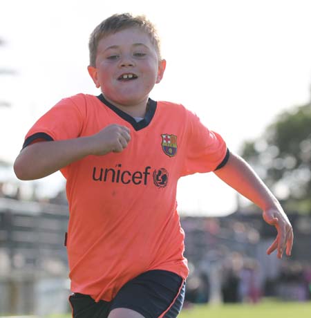 Action from the 2011 community games in Father Tierney Park.