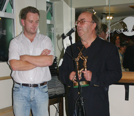 Billy Finn presenting a gift to Dennis Doherty on behalf of the Aodh Ruadh Hurling Committee.