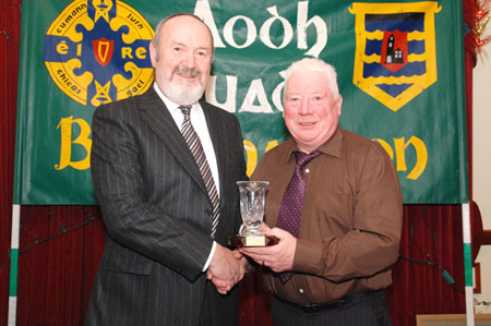Outgoing Bord na nOg Chairman Jim Kane receives an appreciation award from John Travers.
