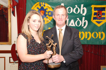 John Larkin presents Ashling Finn with the services for Hurling award, on behalf of her father, Billy.
