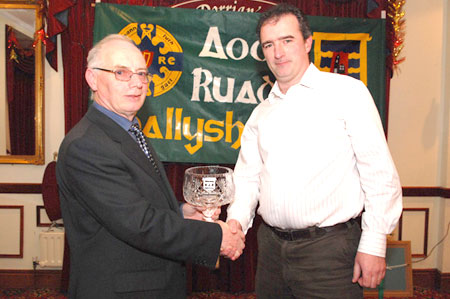John Magee presents John Rooney with the Club Person award.