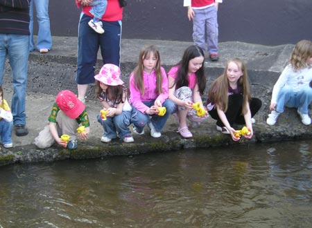 Some race enthusiasts examine the ducks after another hard fought race.