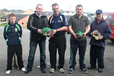 Brendan Whoriskey, Traveller's Rest, Cashelard, handing over a set of helmets to John Rooney, Chairman, Aodh Ruadh Hurling committee. Also present, Peter Horan, under 14 manager, Kevin Loughlin, under 16 manager and Billy Finn.