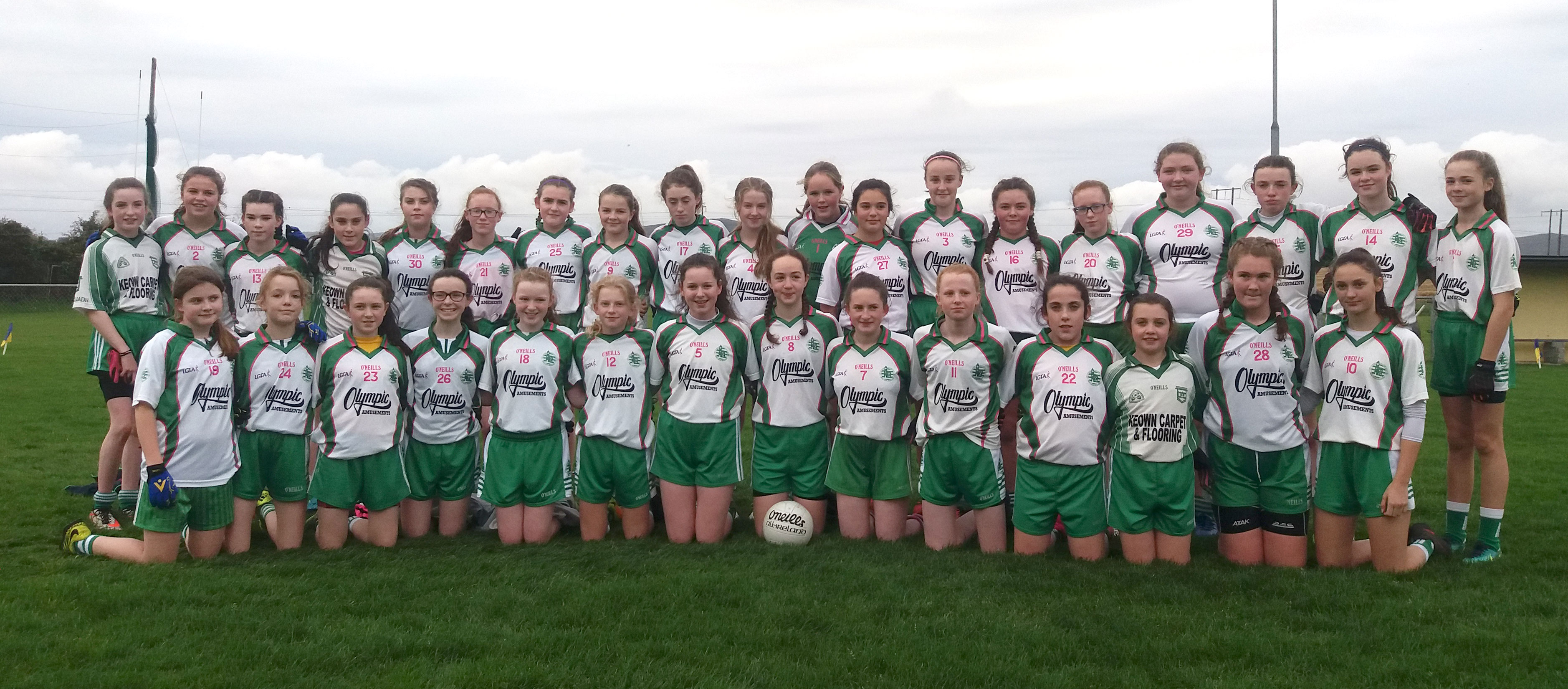 Aodh Ruadh captain Caoimhe Hughes-O'Brien raising the championship trophy.