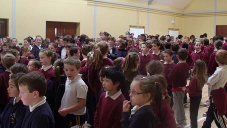 Pupils in Creevy National School wait for sight of the Lory Meagher trophy.