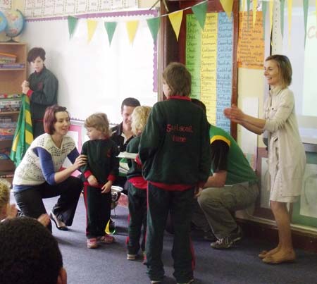 Pupils in the the Gaelscoil make a presentation to the lads.