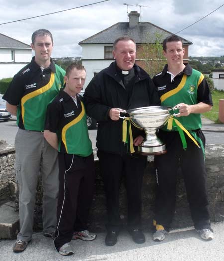 Father McManus gets his hands on the Lory Meagher.