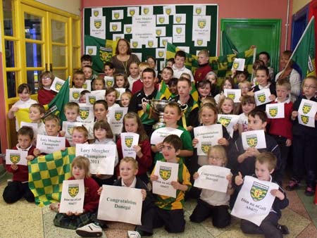 What a welcome. Ms Kavanagh and her pupils welcome the boys to Scoil Chatriona.