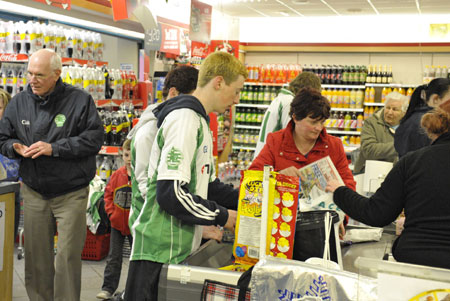 The minors do a bag pack fund-raiser in Mace.