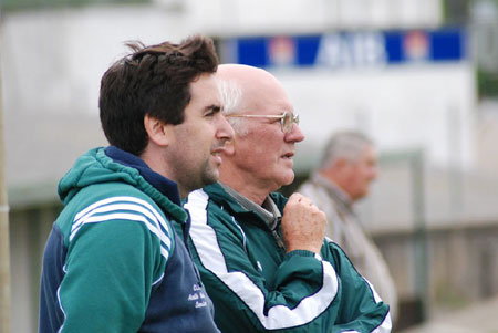 Barry Travers and PJ Buggy take in the play.