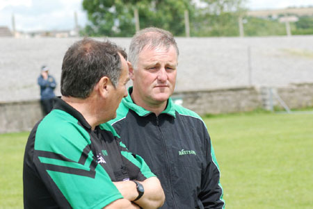 Shane Toolan and Terence McShea watch on.