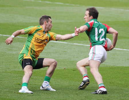 Action from the All-Ireland Senior Football Championship final between Donegal and Mayo.