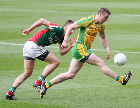 Action from the All-Ireland Senior Football Championship final between Donegal and Mayo.