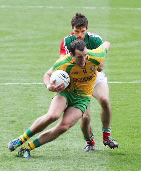 Action from the All-Ireland Senior Football Championship final between Donegal and Mayo.