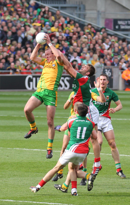 Action from the All-Ireland Senior Football Championship final between Donegal and Mayo.