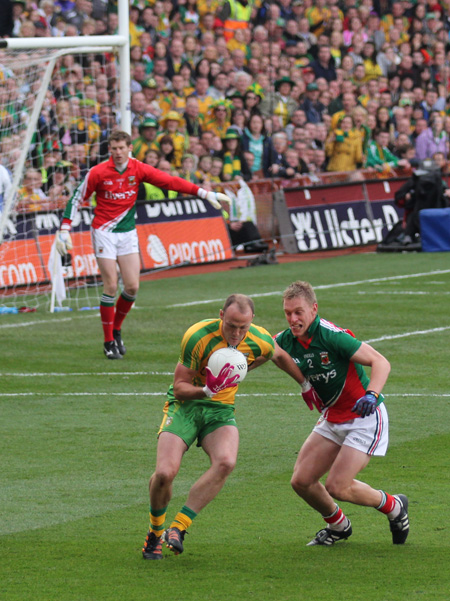 Action from the All-Ireland Senior Football Championship final between Donegal and Mayo.