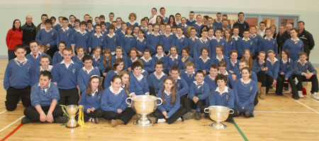 Students and teaching staff  from Colaiste Cholmcille, Ballyshannon pictured with the Sam Maguire, Tom Markham (All-Ireland minor football championship) and McKenna cups when they visited their school last Friday..