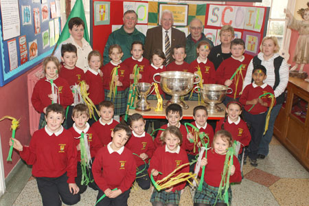 Pupils from Scoil Catriona National School, Ballyshannon pictured with the Sam Maguire, Tom Markham (All-Ireland minor football championship) and McKenna cups when they visited their school last Friday..