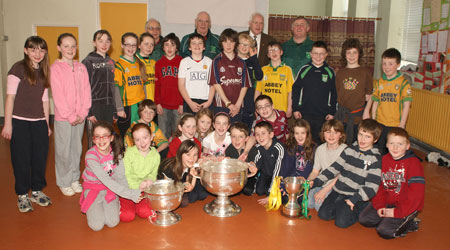 Pupils from Creevy National School, Ballyshannon pictured with the Sam Maguire, Tom Markham (All-Ireland minor football championship) and McKenna cups when they visited their school last Friday.