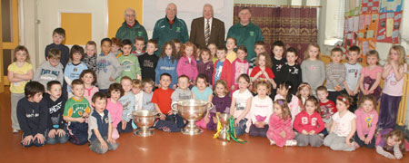 Pupils from Creevy NS School, Ballyshannon pictured with the Sam Maguire, Tom Markham (All-Ireland minor football championship) and McKenna cups when they visited their school last Friday. 