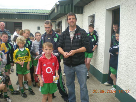 Michael Ayres, under 10 joint manager, presenting Liam O'Sullivan, fifth in the under 10 section with his medal.