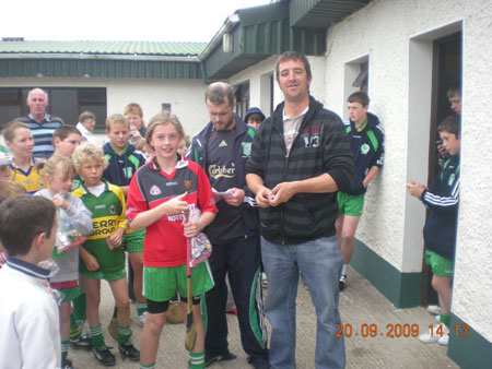 Michael Ayres, under 10 joint manager, presenting Méabh Rooney, fourth in the under 10 section with his medal.
