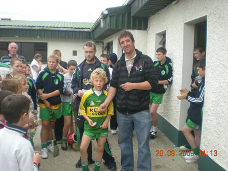 Michael Ayres, under 10 joint manager, presenting Stephen Anderson, second in the under 10 section with his medal.