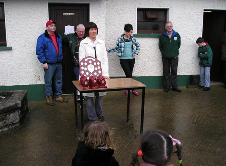 Sean Slevin's widow, Patricia, makes a speech before the presentation of medals and plaques.